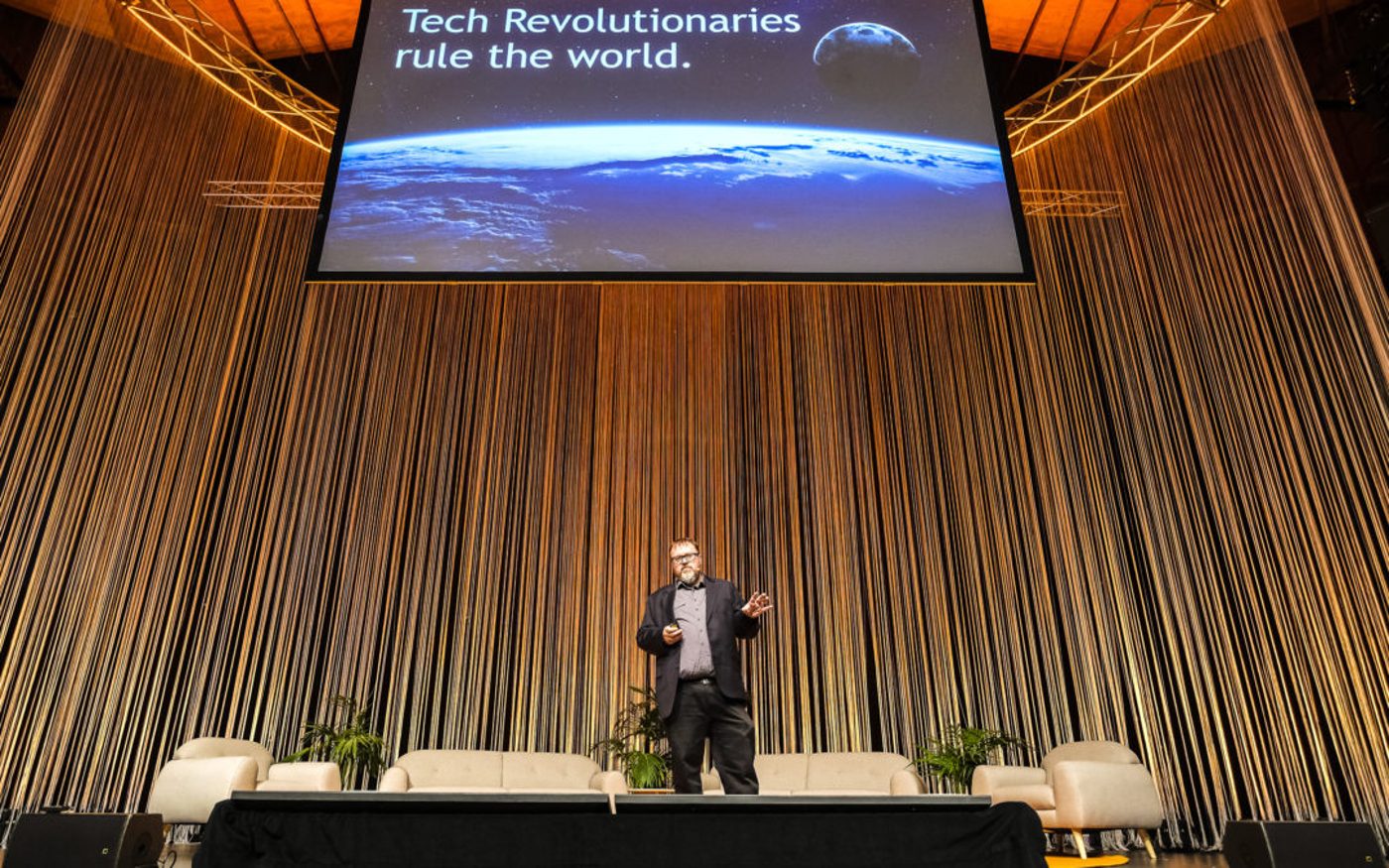 Paul Spain delivering a keynote on stage